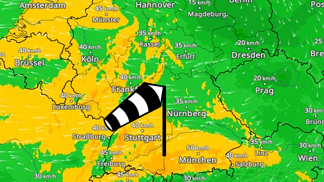 Wetterkarte von Deutschland mit farbiger Winddarstellung und Geschwindigkeiten. Pfeile zeigen starken Wind aus Westen nach Osten, besonders im Westen und Süden. Städte wie Köln, Frankfurt und München sind beschriftet.