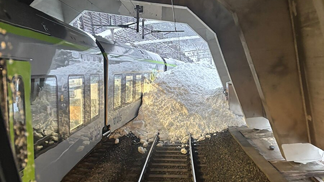 The picture shows a train in the Alps that was hit by an avalanche.