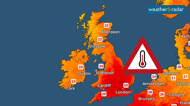 Temperature map of the UK and western Europe showing hot conditions across Britain, with temperatures reaching 33°C near London, 29°C around Cardiff, 24°C near Liverpool, and a large heat warning symbol highlighting elevated heat risk.