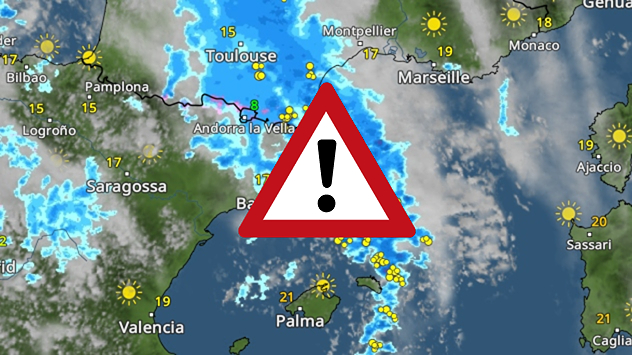 Wetterkarte mit Regengebieten und Warnsymbol über Südfrankreich und Nordspanien.