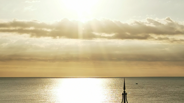 View of the North Sea with rays of sunlight streaming down over cloud.