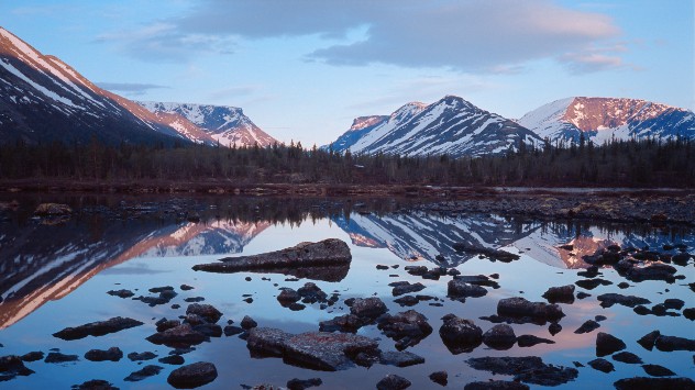 Midnight in June in the Khibiny Mountains, Arctic Russia, with a light blue sky
