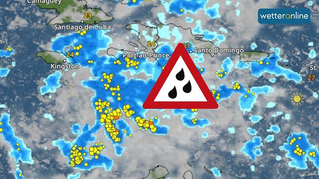 WetterRadar mit Starkregen und Gewittern über Jamaika und Haiti, Warnsymbol in der Mitte.