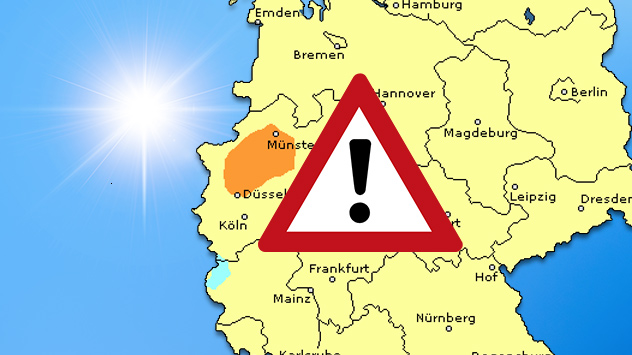 Deutschlandkarte mit farblich markierten Ozonbelastungszonen: orangefarbenes Gebiet um Münster, Warnsymbol in der Landesmitte, Sonnenschein im Hintergrund.