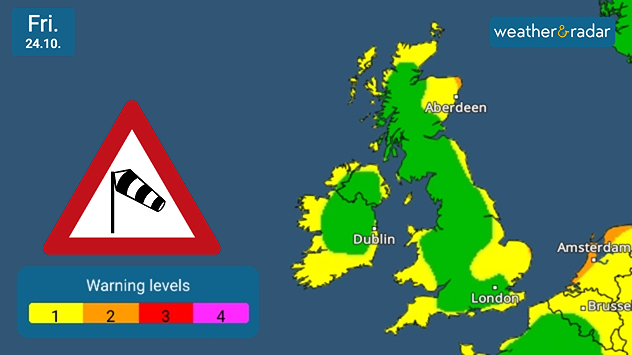 Weather map of the UK and Ireland dated Thursday 23 October showing green to yellow warning levels, with a wind warning sign and color scale from level 1 to 4. Yellow warnings seen across southern Ireland and coasts, eastern England, Wales, and eastern Scotland.