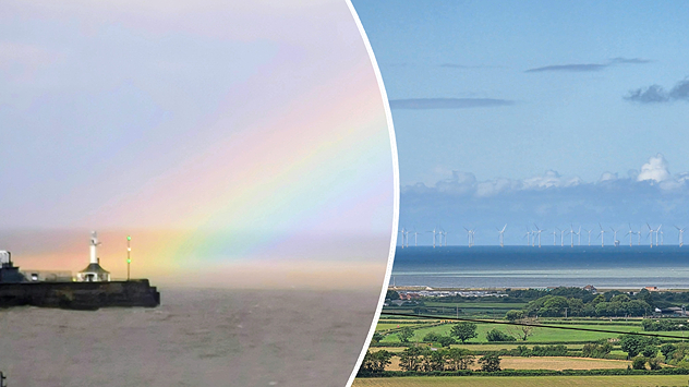 Split image showing a pastel rainbow above a lighthouse and harbor wall on the left, and an offshore wind farm stretching across the sea beyond green coastal farmland on the right.