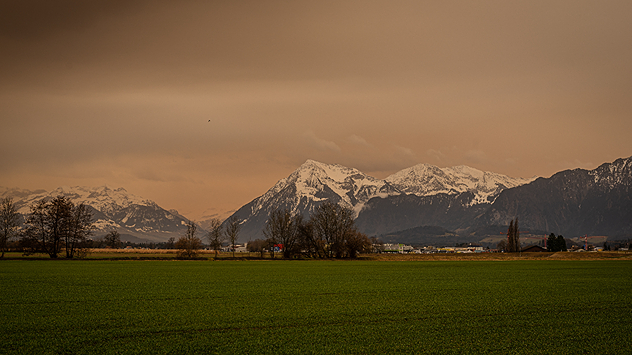 Sahara dust clouds the skies over south-western Europe and colours the clouds yellowish.
